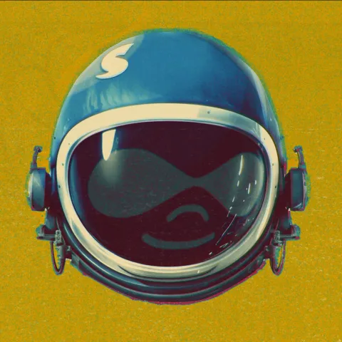 A Druplicon, heavily stylized to look like it's wearing an astronaut helmet, against a yellow background.