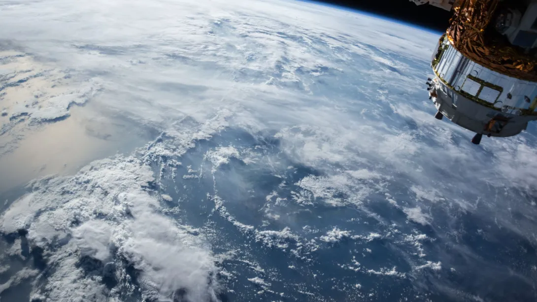 An orbital view of one of Earth's oceans, with significant cloud cover.